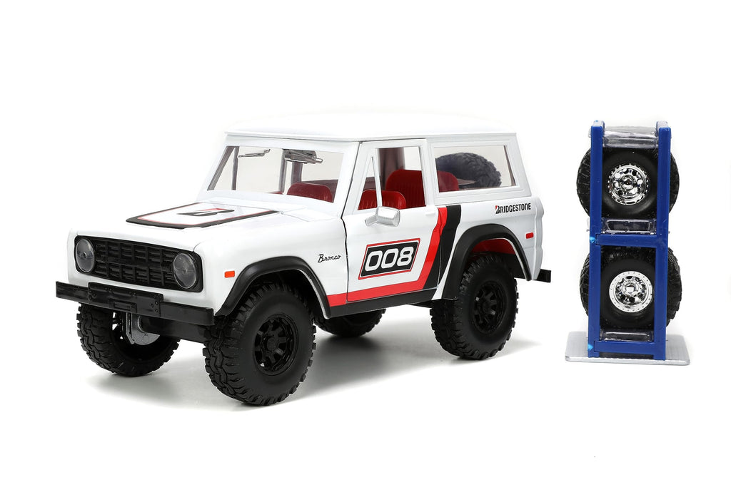 Just Trucks 1:24 1973 Ford Bronco Bridgestone Die-Cast Truck & Tire Rack, Toys for Kids and Adults(White/Red)