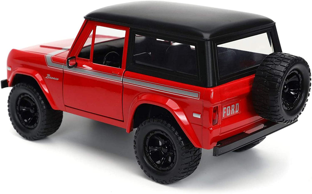1973 Ford Bronco Red with Black Top and Silver Stripe with Extra Wheels Just Trucks Series 1/24 Diecast Model Car by Jada 32425