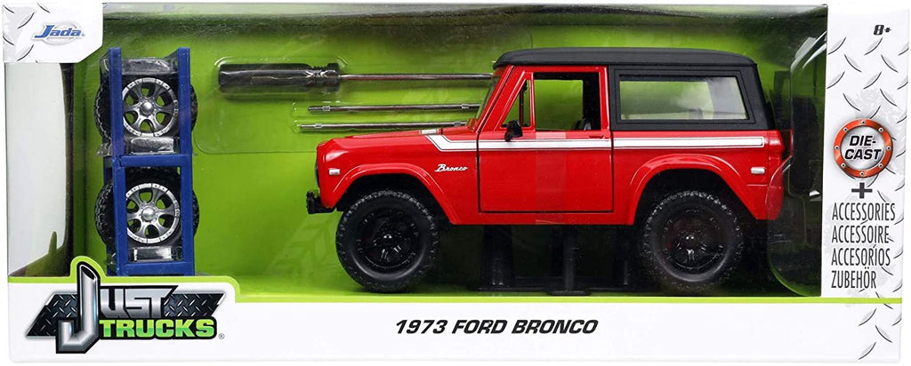 1973 Ford Bronco Red with Black Top and Silver Stripe with Extra Wheels Just Trucks Series 1/24 Diecast Model Car by Jada 32425